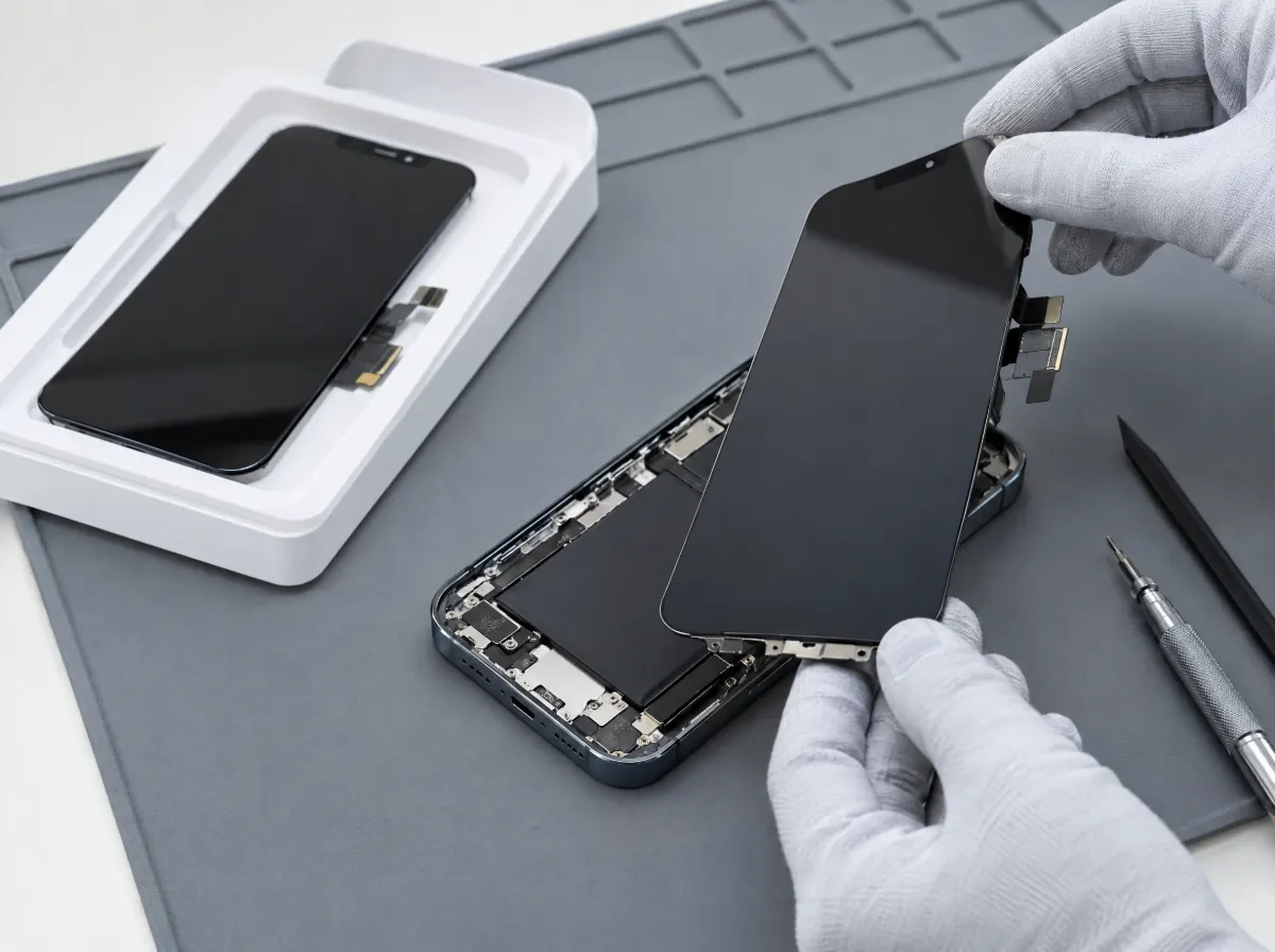 Fitting a genuine Apple iPhone display replacement, with the new screen in its packaging tray