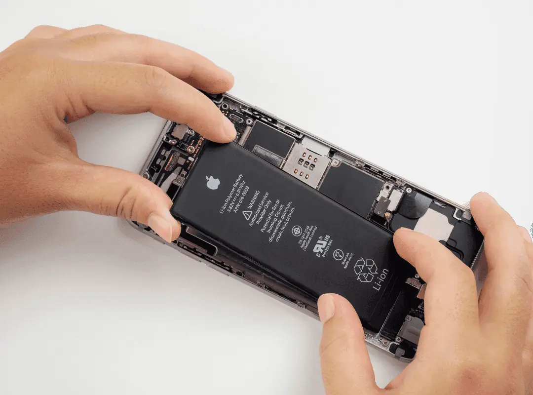 Technician replacing an iPhone battery during genuine Apple iPhone battery replacement in Malaysia