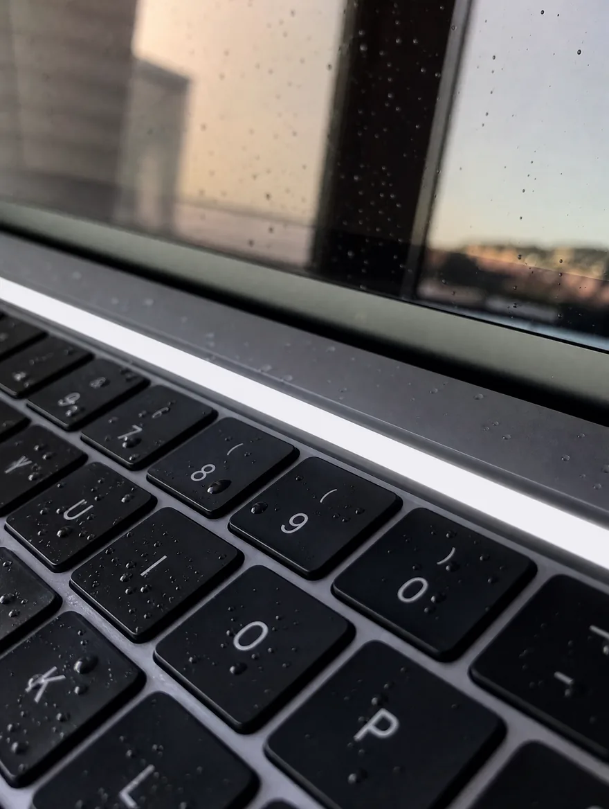 MacBook Pro Touch Bar showing a solid white bar after liquid damage