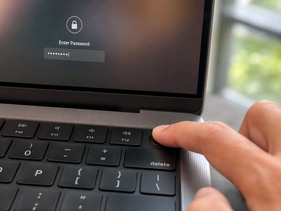 Finger on a MacBook Touch ID sensor that fails to recognise the fingerprint, a reason for MacBook Touch ID replacement in Malaysia
